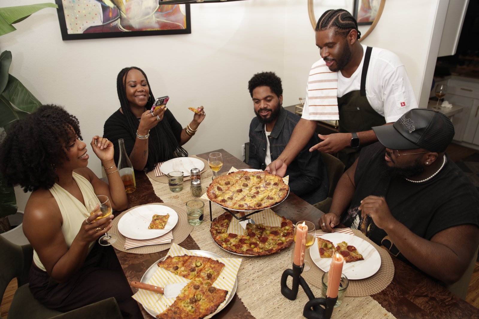 Friends gathered around Morros & Squares pizza
